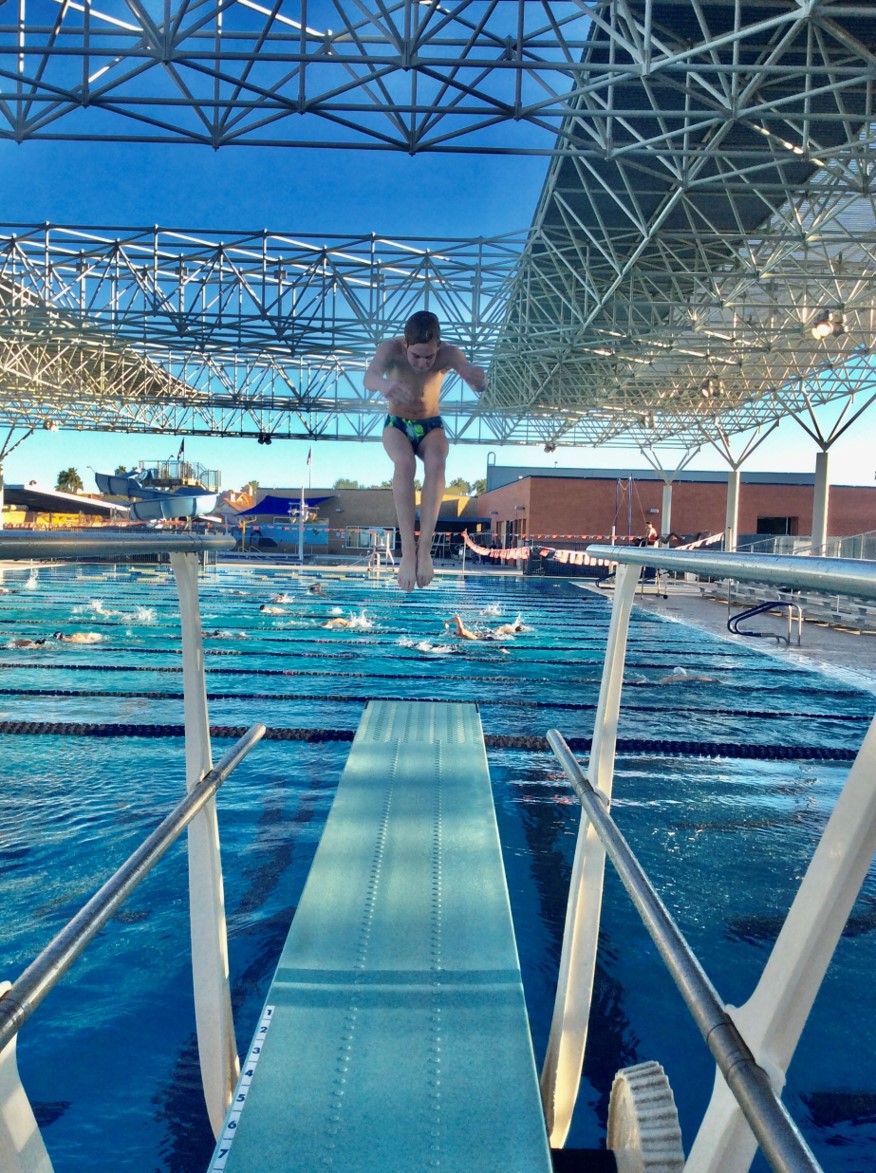 A diver doing an inward of off one meter