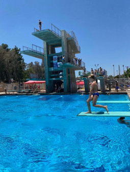 Riverside pool with a diver doing a hurdle